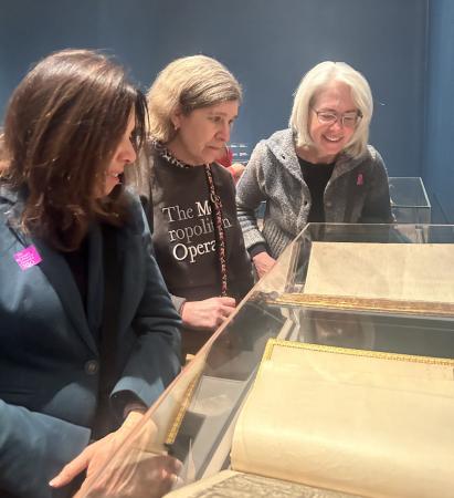 From left, Rev. Dr. Julie Faith Parker, Rev. Dr. Sidnie White Crawford, and Ruth Frey of Trinity Wall Street examine the Tyndale Bible at the Morgan Library