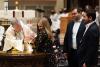 A child is baptized in Trinity Church on All Saints Sunday 2021