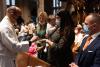 Families receive communion in Trinity Church on All Saints Sunday 2021