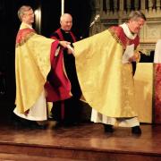 the Rev. Dr. James Cooper, 17th Rector, gave a baton to Lupfer.