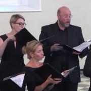 Members of The Choir of Trinity Wall Street sing in St. Paul's Chapel