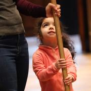 A child serves during worship at Trinity Church