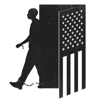 A man walks out of a door shaped like an American Flag. The chains on his wrist and ankle break as he hits his stride.